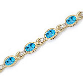 10K Yellow Gold Oval Blue Topaz and Diamond Bracelet