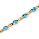 14K Yellow Gold Oval Blue Topaz and Diamond Bracelet