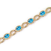 14K Yellow Gold Oval Blue Topaz Bracelet